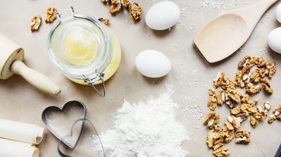 baking ingredients on table with rolling pin and spoon
